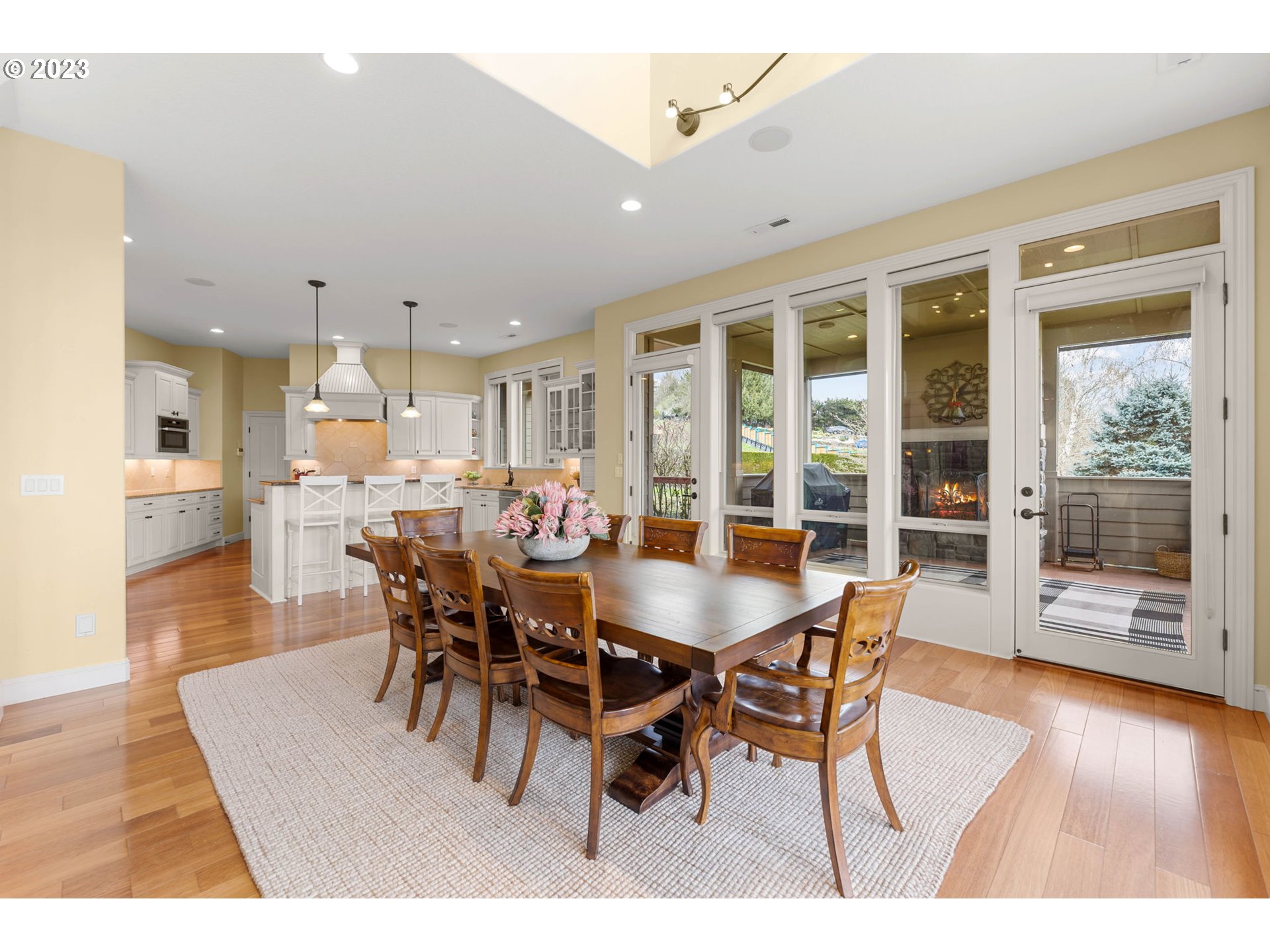6405 Northwest 202nd Circle Ridgefield, WA 98642 - Photo 18 of 45 a dining room with furniture and wooden floor
