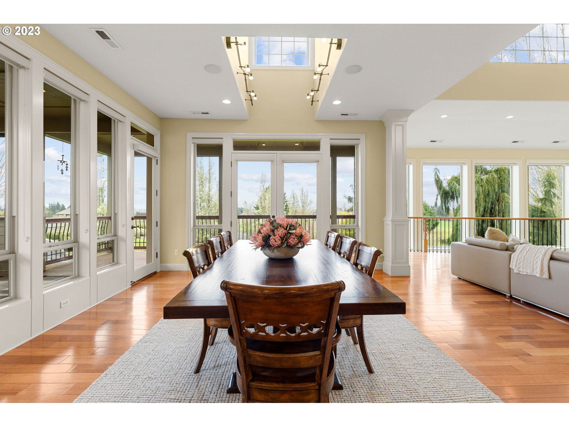 6405 Northwest 202nd Circle Ridgefield, WA 98642 - Photo 20 of 45 a view of a dining room with furniture wooden floor and a chandelier