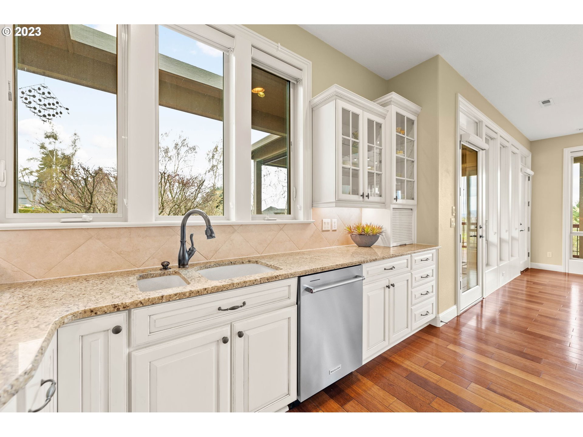 6405 Northwest 202nd Circle Ridgefield, WA 98642 - Photo 23 of 45 a kitchen with granite countertop a sink and a window