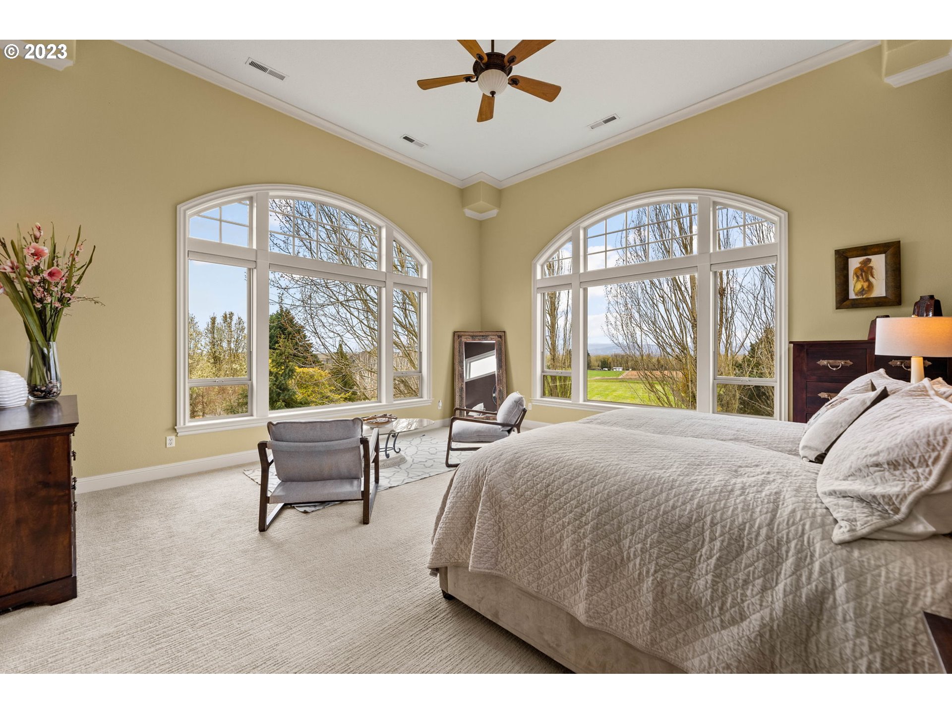 6405 Northwest 202nd Circle Ridgefield, WA 98642 - Photo 25 of 45 a bedroom with a large bed and a large window