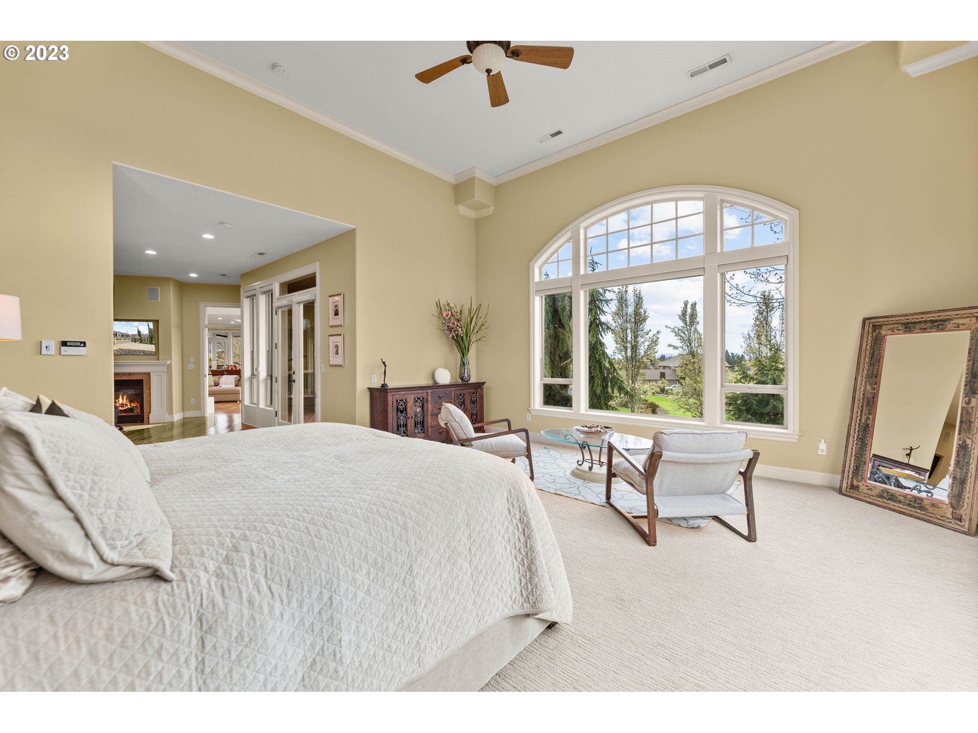6405 Northwest 202nd Circle Ridgefield, WA 98642 - Photo 27 of 45 a bedroom with a large bed and a large window