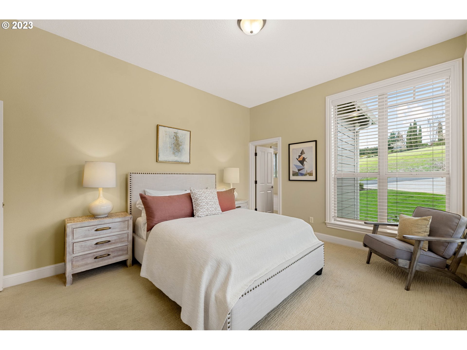 6405 Northwest 202nd Circle Ridgefield, WA 98642 - Photo 29 of 45 a bedroom with a bed a couch and large window