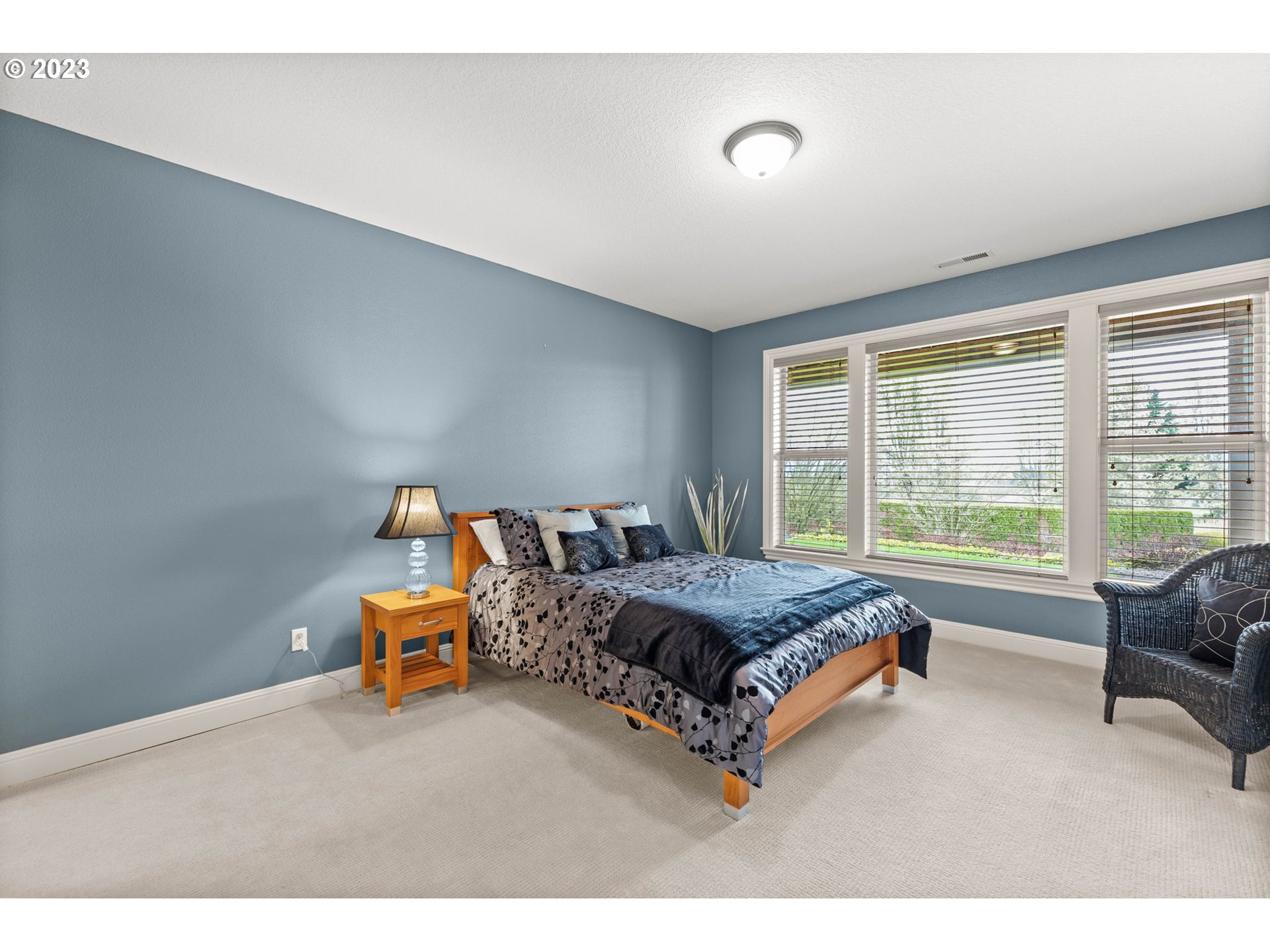 6405 Northwest 202nd Circle Ridgefield, WA 98642 - Photo 34 of 45 a bed room with a bed and a couch