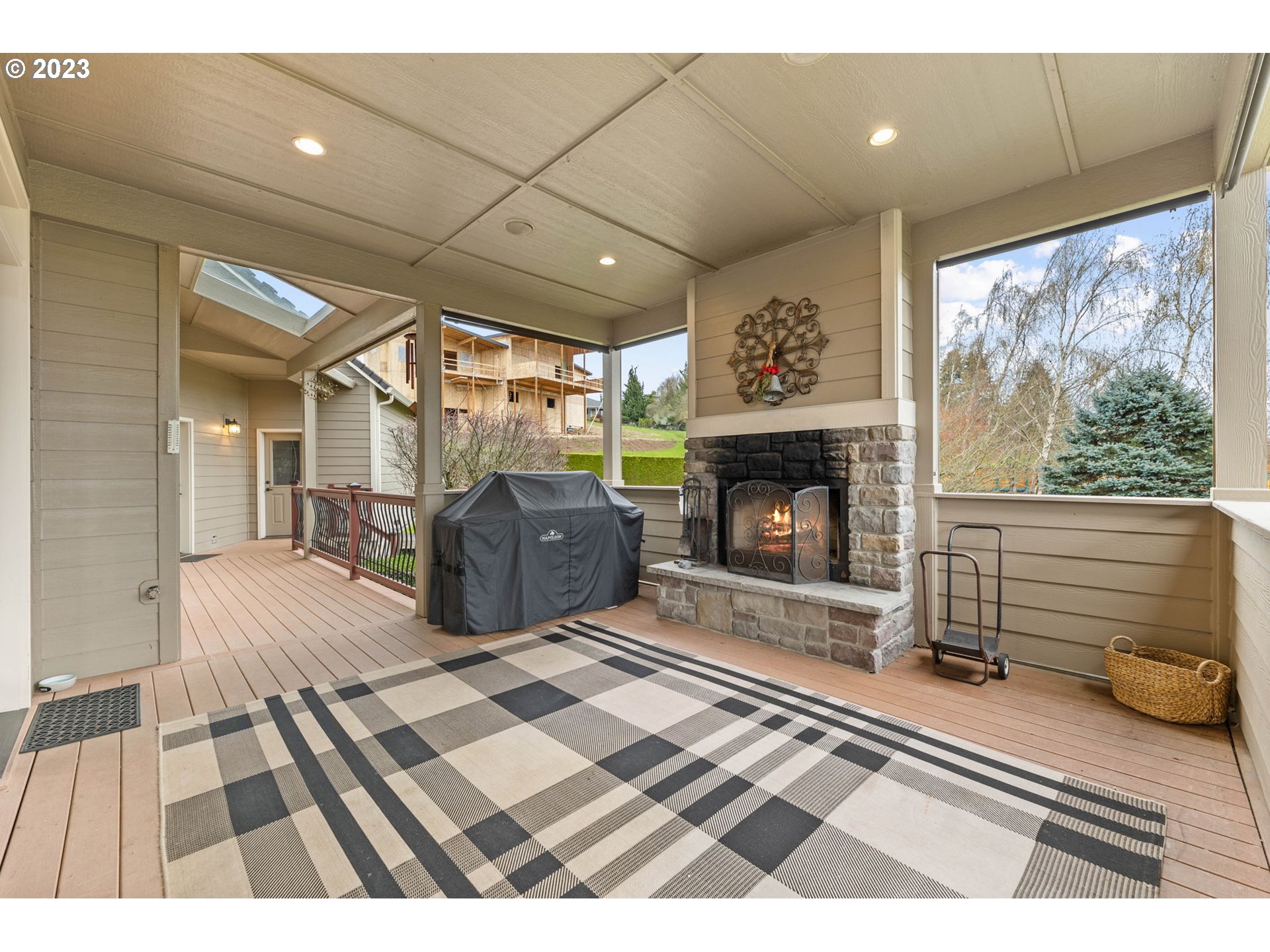 6405 Northwest 202nd Circle Ridgefield, WA 98642 - Photo 40 of 45 a spacious bedroom with a bed and a fireplace