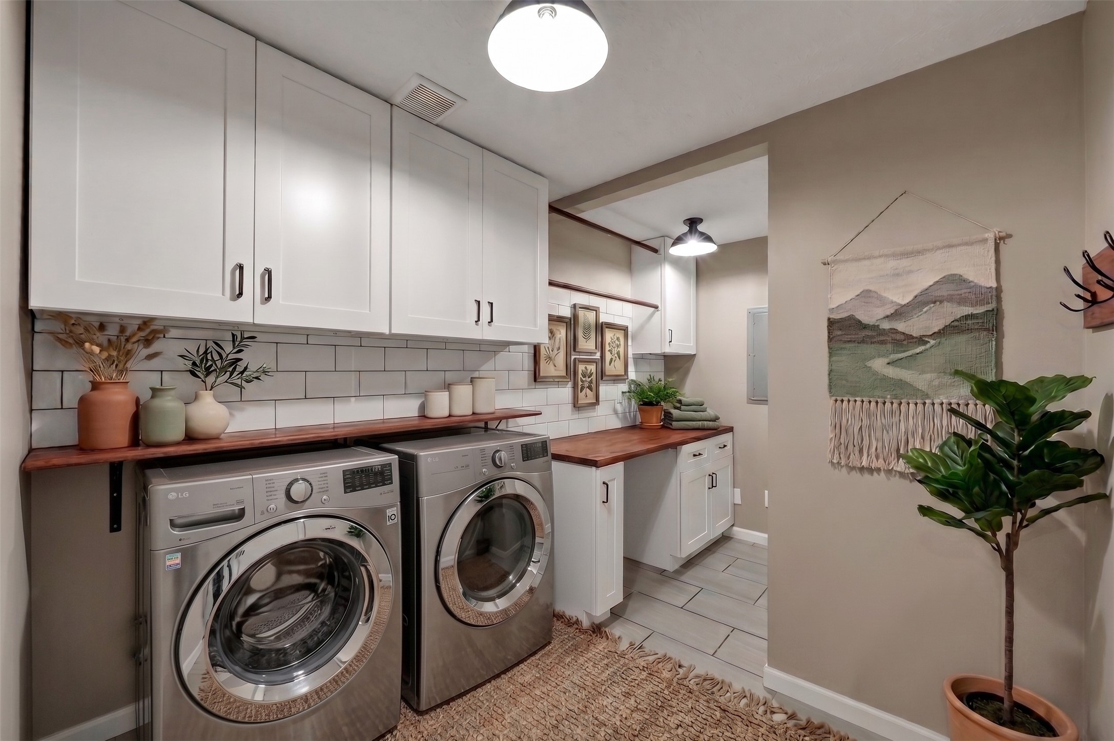 12224 Gun Oak Place Spring, TX 77380 - Photo 5 of 37 Renovated Laundry Room with Updated Finishes and Additional Storage Space (Virtually Staged)
