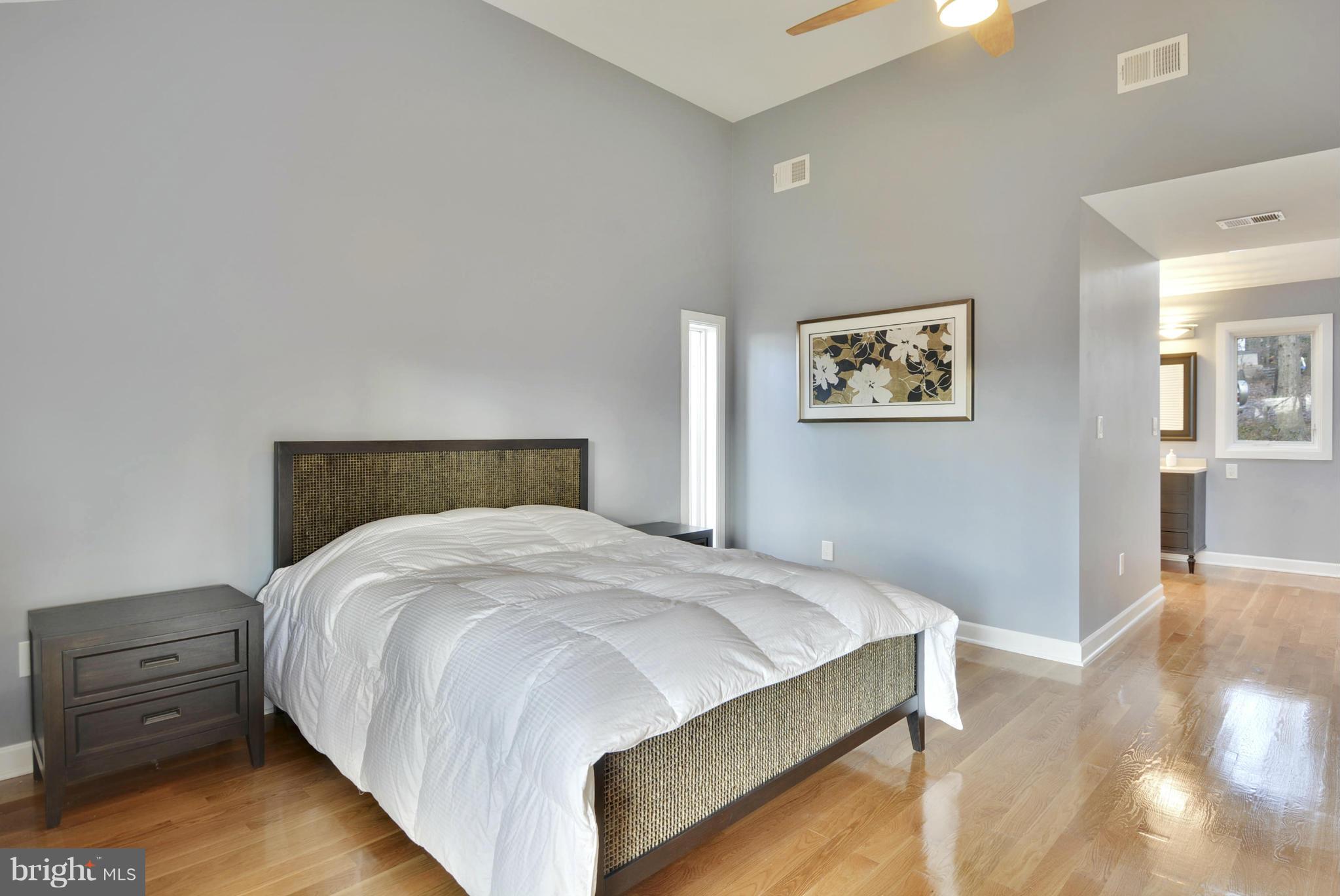 11256 Oakton Road Oakton, VA 22124 - Photo 11 of 29 a bedroom with a bed and painting on the wall