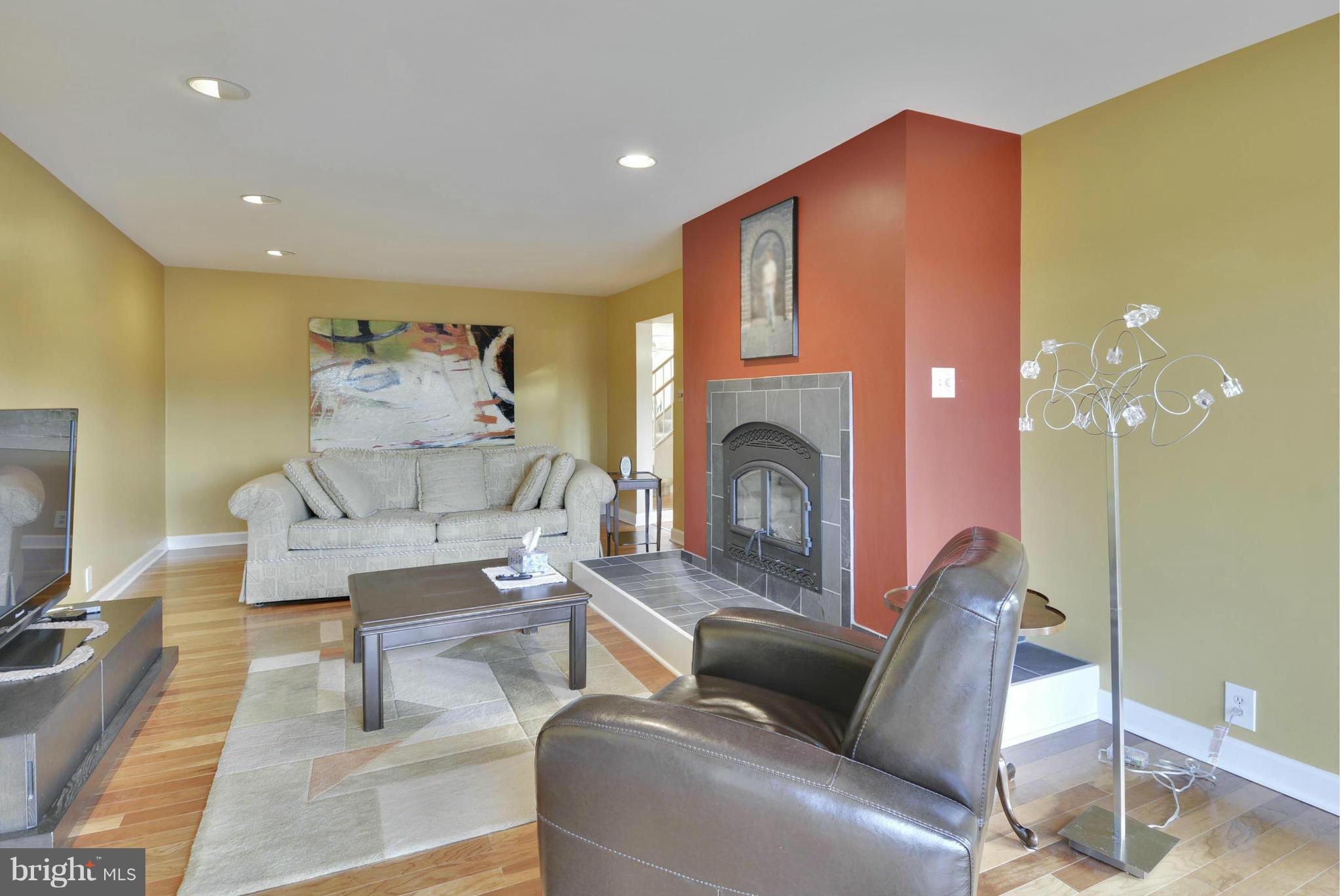 11256 Oakton Road Oakton, VA 22124 - Photo 3 of 29 a living room with furniture and a fireplace
