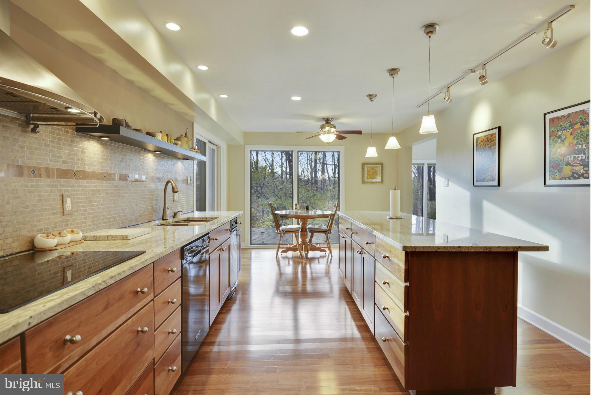 11256 Oakton Road Oakton, VA 22124 - Photo 5 of 29 a kitchen with counter top space sink and center