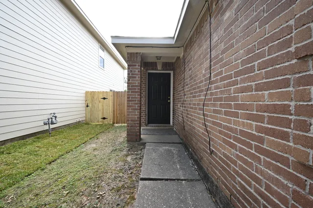 a view of a pathway besides a house