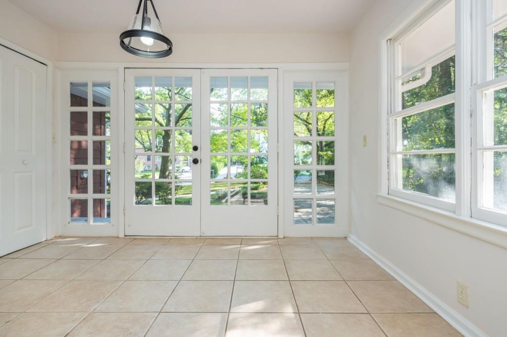 1392 Lively Ridge Road Northeast Atlanta, GA 30329 - Photo 19 of 42 a view of an empty room with windows and chandelier