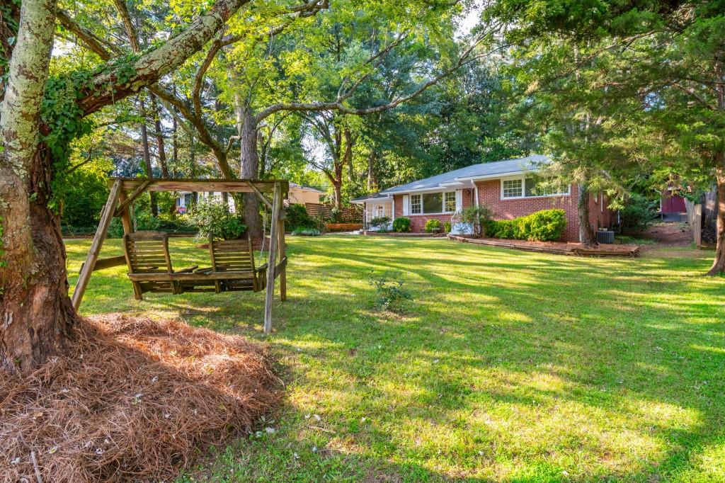 1392 Lively Ridge Road Northeast Atlanta, GA 30329 - Photo 2 of 42 a view of a house with a yard