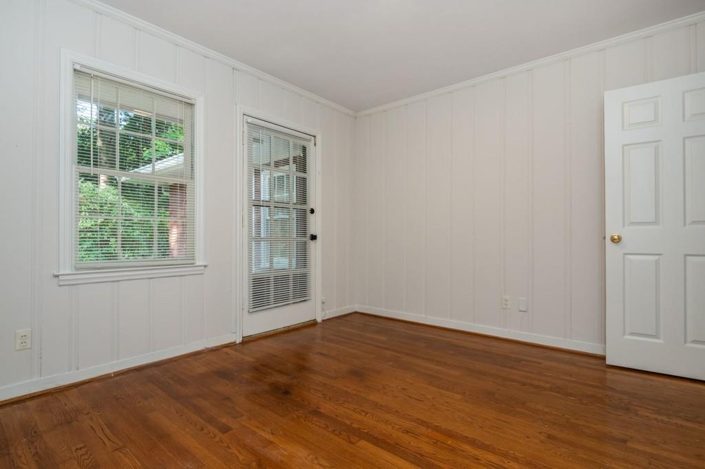 1392 Lively Ridge Road Northeast Atlanta, GA 30329 - Photo 25 of 42 an empty room with wooden floor and windows