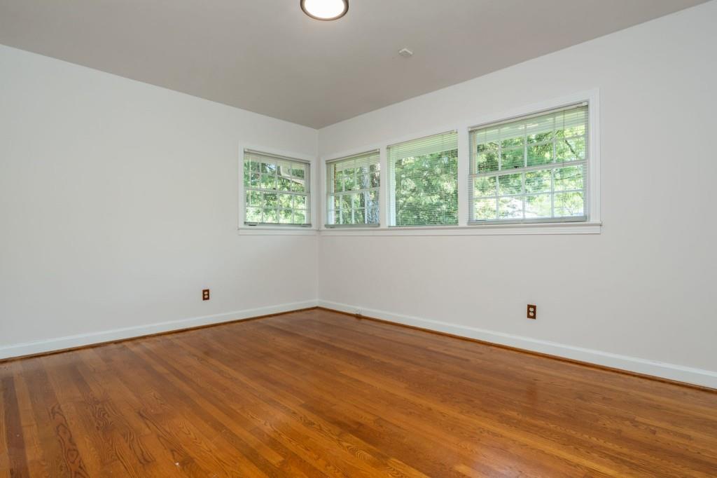1392 Lively Ridge Road Northeast Atlanta, GA 30329 - Photo 27 of 42 wooden floor in an empty room with a window
