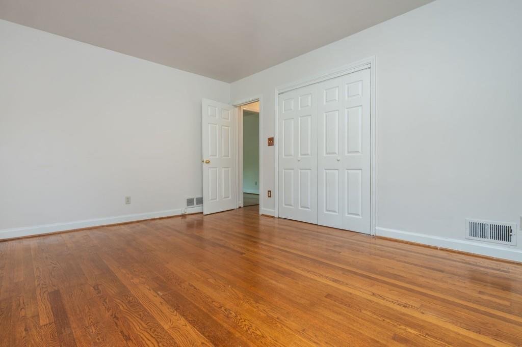 1392 Lively Ridge Road Northeast Atlanta, GA 30329 - Photo 28 of 42 a view of an empty room with wooden floor