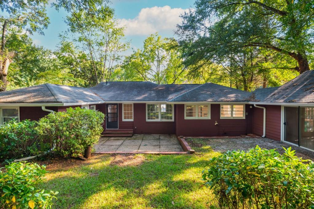 1392 Lively Ridge Road Northeast Atlanta, GA 30329 - Photo 40 of 42 front view of a house with a yard