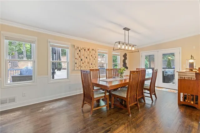 a view of a dining room with furniture window and wooden floor