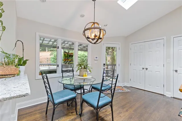 a view of a dining room with furniture window and wooden floor