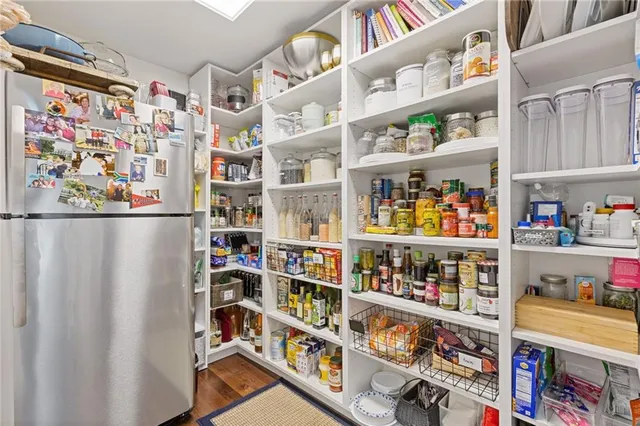 a shelf with books and knick knacks on it