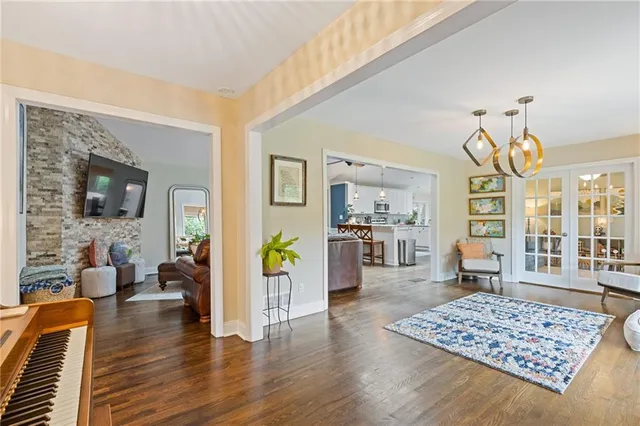 a living room with furniture and wooden floor