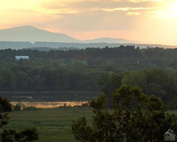 a view of a lake in middle of the town