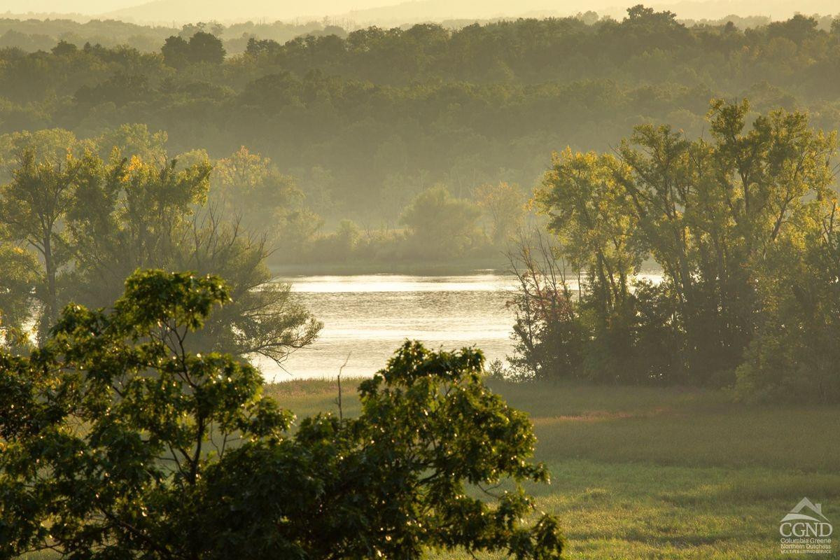 6881 Rod And Gun Road Hudson, NY 12534 - Photo 6 of 27 a view of a lake with a mountain