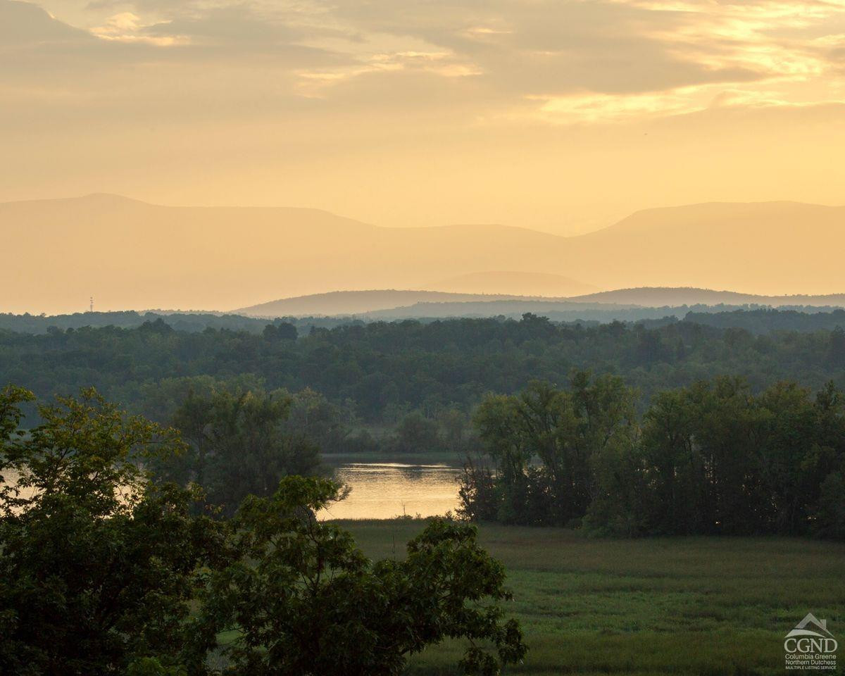 6881 Rod And Gun Road Hudson, NY 12534 - Photo 10 of 27 a view of a lake with a mountain