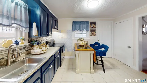 a view of a kitchen area with furniture and stove