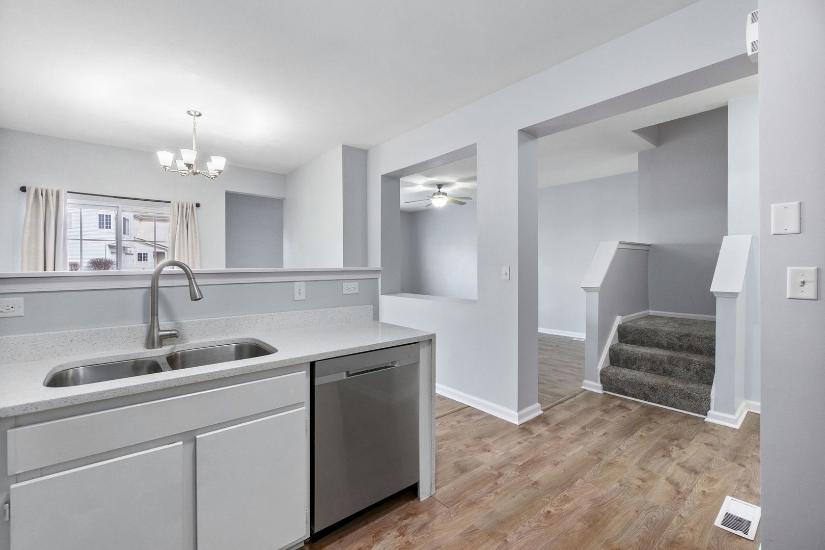 199 North Oakhurst Drive, Unit 199 Aurora, IL 60504 - Photo 11 of 25 a kitchen with a sink and a refrigerator