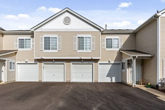 a front view of a house with a garage