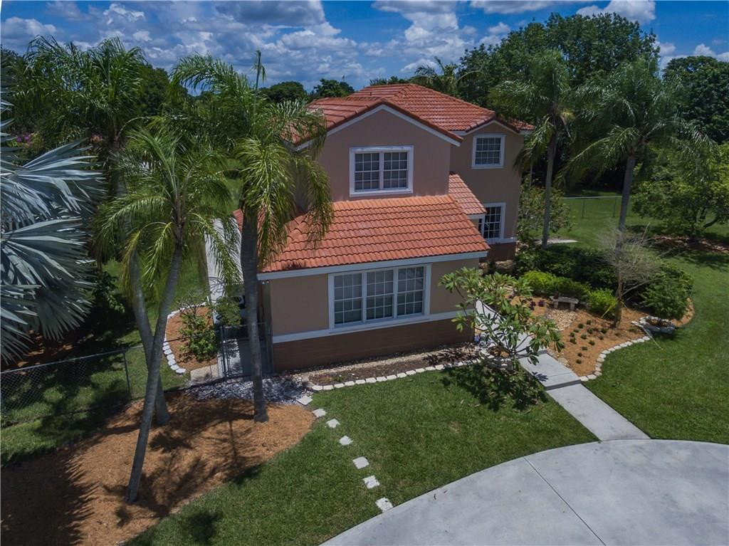 17401 Sunset Drive Southwest Ranches, FL 33331 - Photo 1 of 45 a front view of house with yard and green space