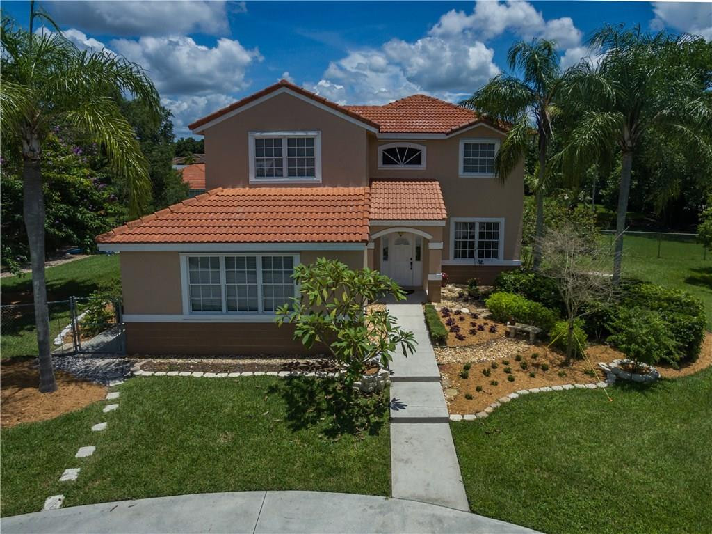 17401 Sunset Drive Southwest Ranches, FL 33331 - Photo 2 of 45 a front view of a house with a yard