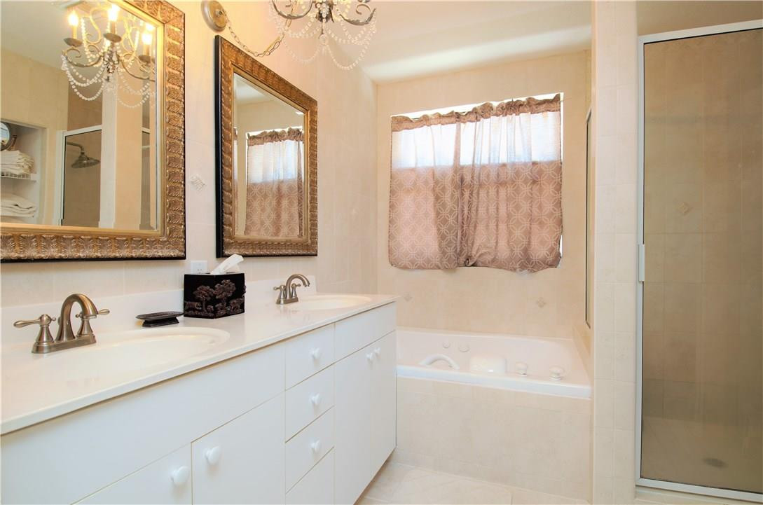 17401 Sunset Drive Southwest Ranches, FL 33331 - Photo 22 of 45 a bathroom with a sink and a bathtub