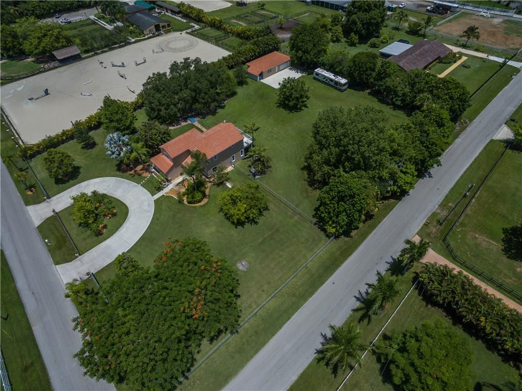 17401 Sunset Drive Southwest Ranches, FL 33331 - Photo 42 of 45 an aerial view of a house with a yard and outdoor seating