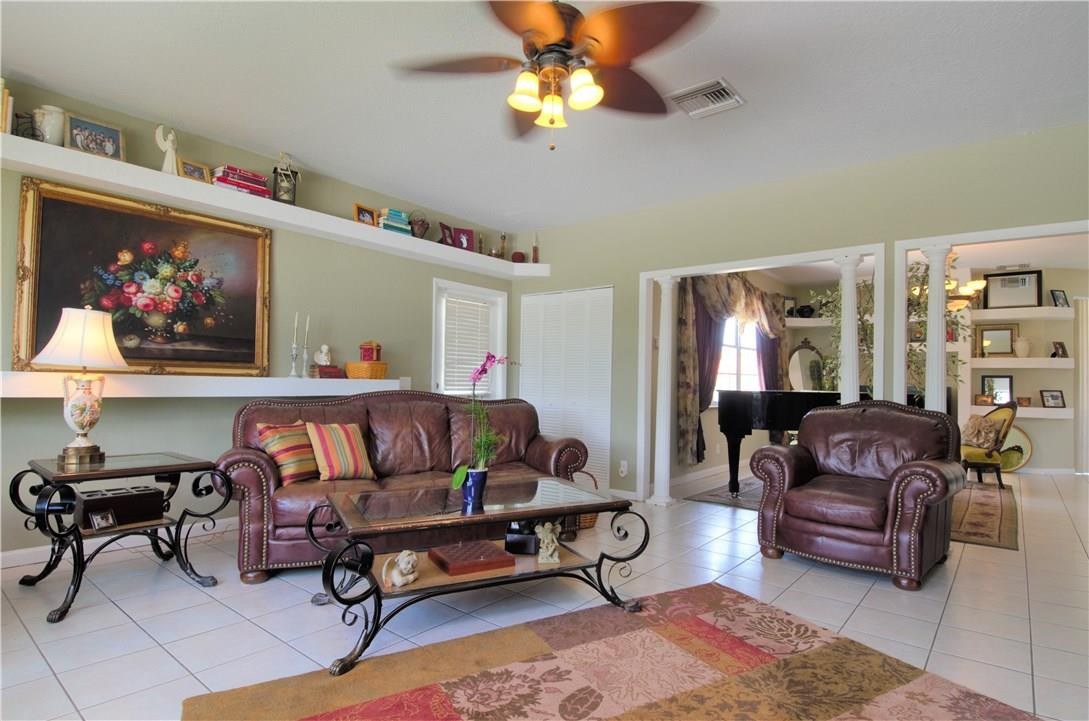 17401 Sunset Drive Southwest Ranches, FL 33331 - Photo 8 of 45 a living room with furniture and a flat screen tv