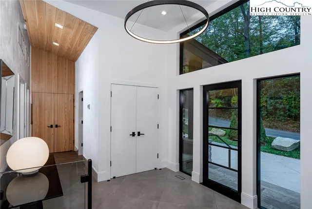 a living room with furniture wooden floor and a fireplace