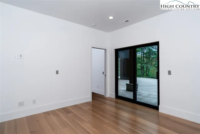 a bedroom with bed and cabinets