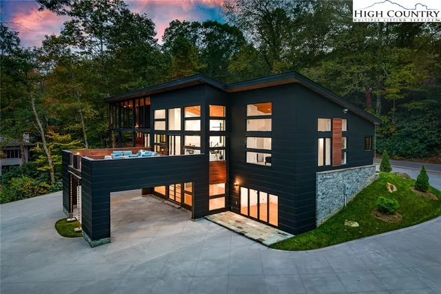 a view of a chairs and bench in the backyard