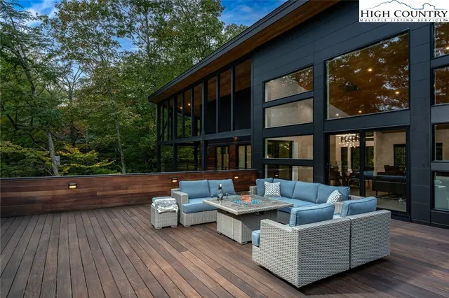 a outdoor living space with patio furniture and a wooden floor