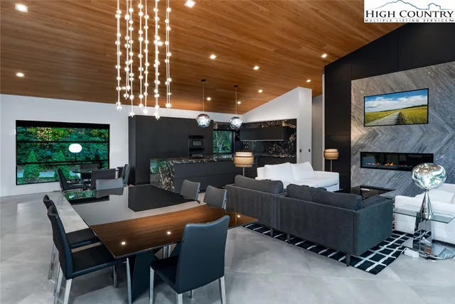 a living room with fireplace furniture and a flat screen tv