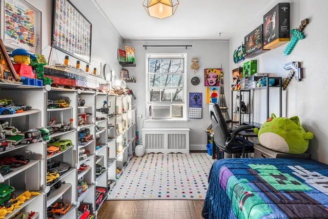 a bed room with a bed and a book shelf