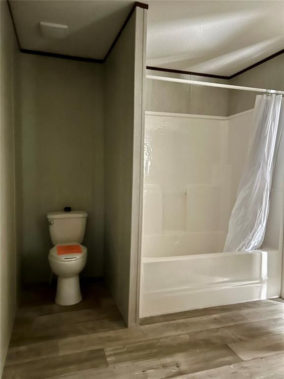 13751 Northeast 5 Street Williston, FL 32696 - Photo 12 of 17 a bathroom with a toilet and a shower