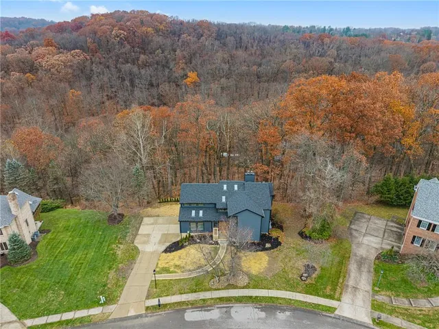 an aerial view of a house with mountain view
