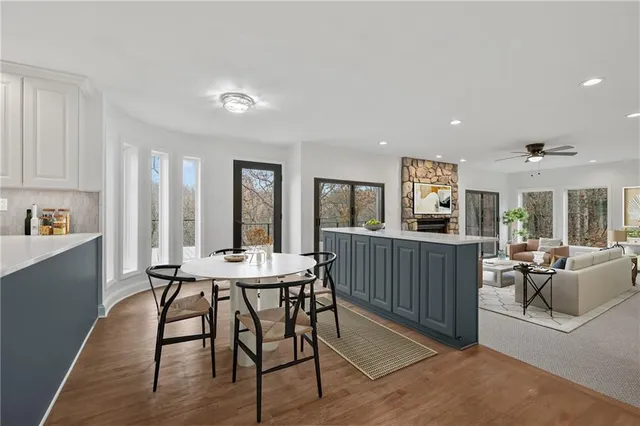 a spacious bedroom with a bed a couch and a window