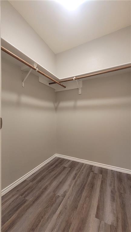 15405 Spring Hill Lane, Unit B Pflugerville, TX 78660 - Photo 12 of 18 a view of an empty walk in closet