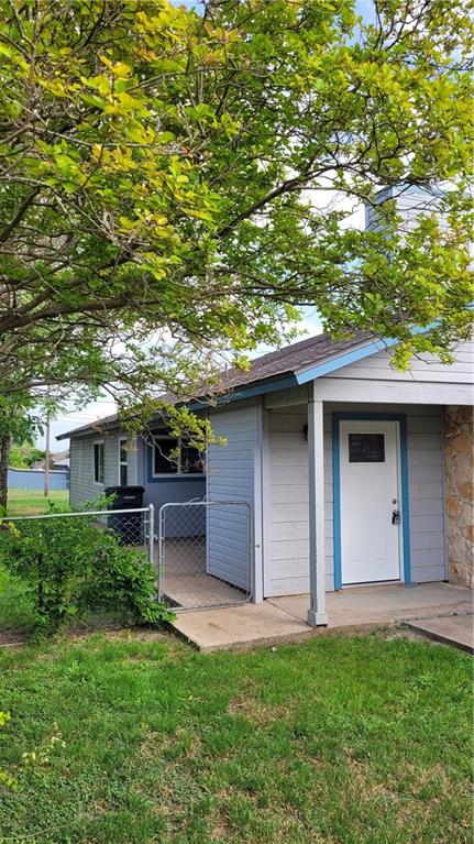15405 Spring Hill Lane, Unit B Pflugerville, TX 78660 - Photo 2 of 18 a house view with a garden space