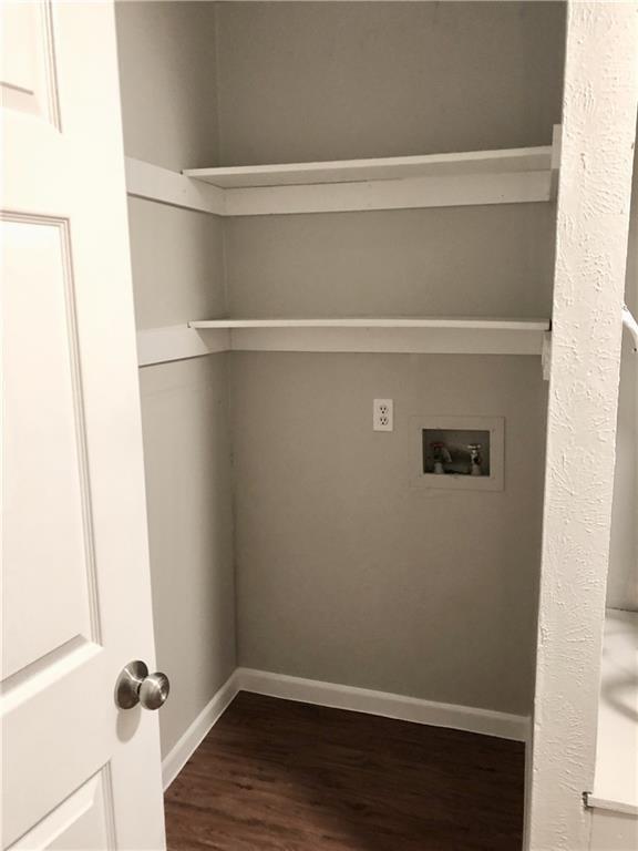 15405 Spring Hill Lane, Unit B Pflugerville, TX 78660 - Photo 7 of 18 a view of a room with wooden floor