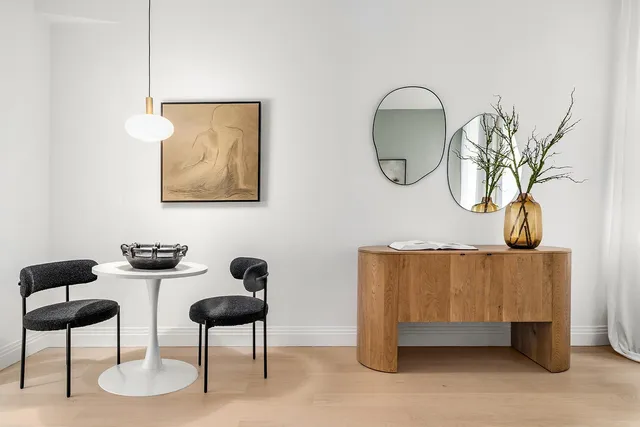 a dining room with furniture and window