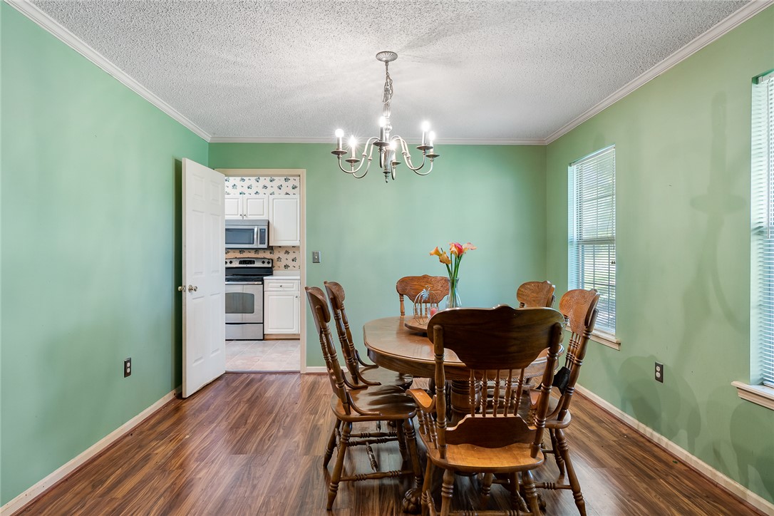 306 Lakewood Drive Anderson, SC 29621 - Photo 3 of 17 This dining area showcases a warm and inviting atmosphere, perfect for everyday meals and entertaining.
