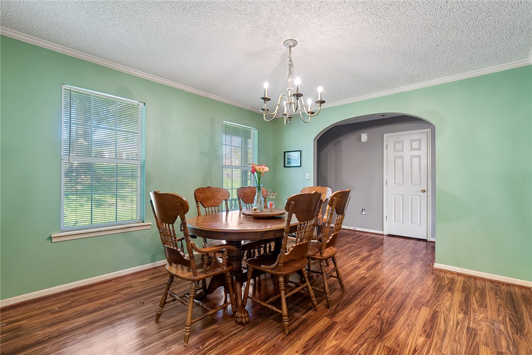 306 Lakewood Drive Anderson, SC 29621 - Photo 4 of 17 This inviting dining area features elegant flooring and abundant natural light, creating a bright atmosphere.