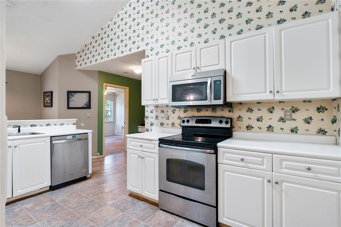 306 Lakewood Drive Anderson, SC 29621 - Photo 8 of 17 This functional kitchen features ample cabinetry and modern appliances, perfect for daily living and culinary pursuits.